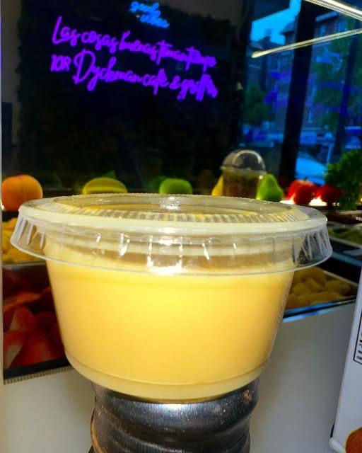 Mango smoothie in a sealed cup